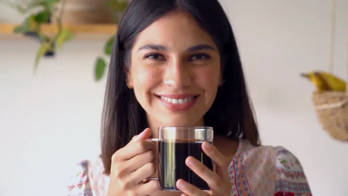 happy and comfortable woman sipping coffee